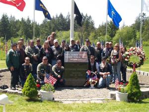 Vets around Memorial podium